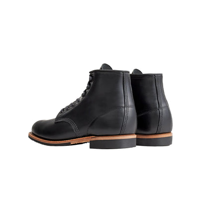 Pair of black leather boots on a white background