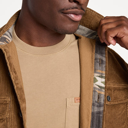 Man wearing a brown jacket with a patterned lining, focusing on the collar area.