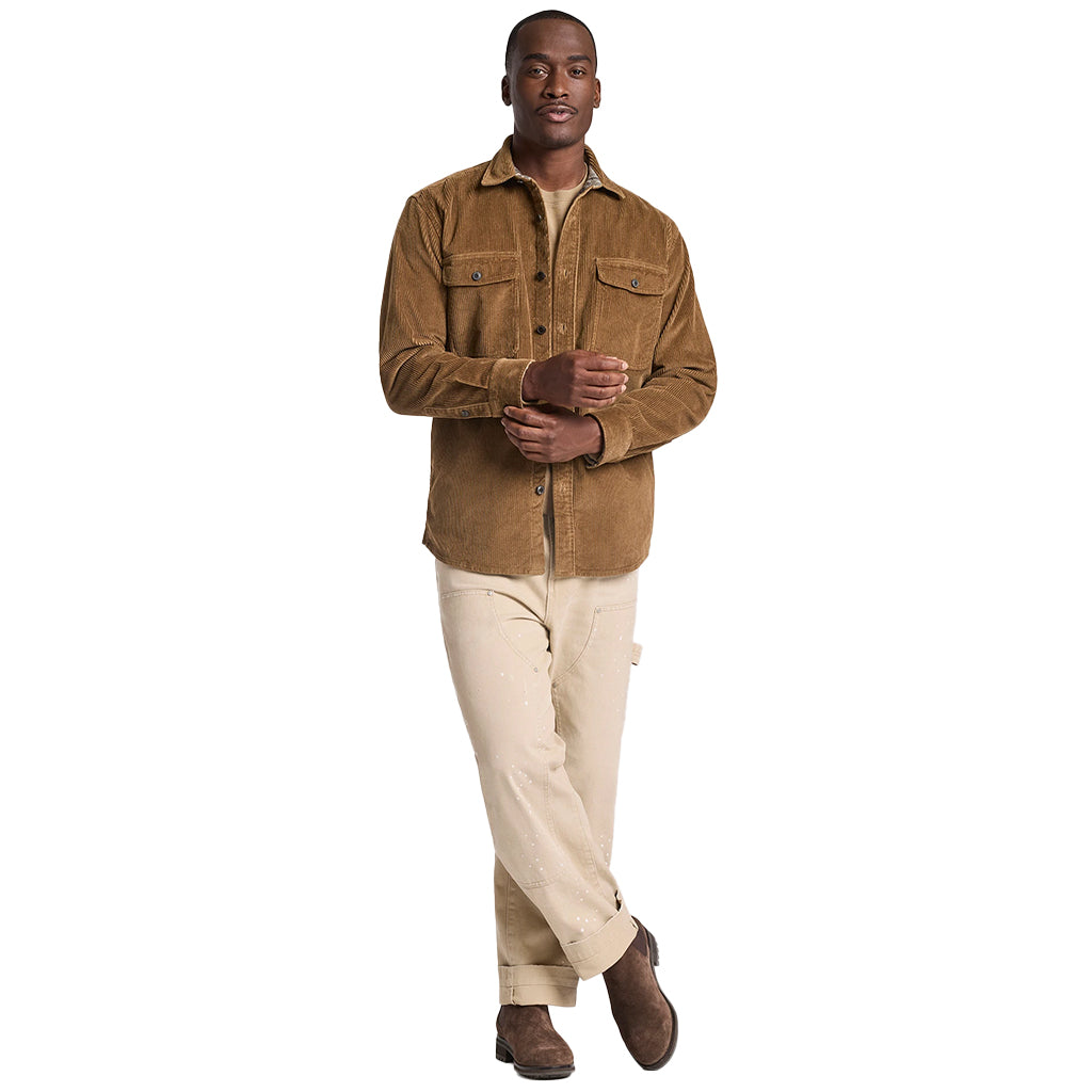 Man wearing a brown jacket and beige pants on a white background