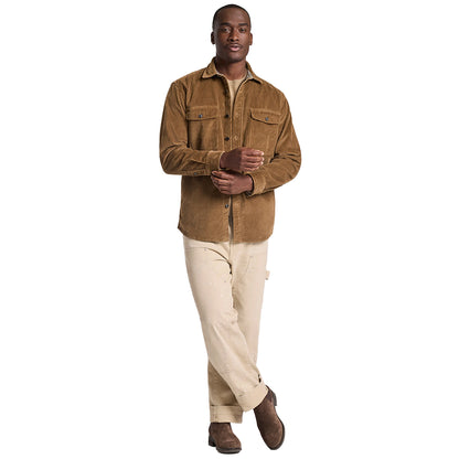 Man wearing a brown jacket and beige pants on a white background