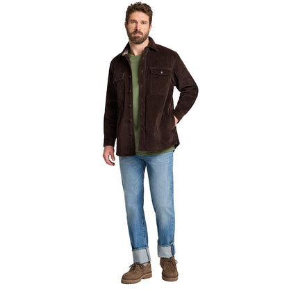 Man wearing a brown jacket, green shirt, blue jeans, and brown boots on a white background