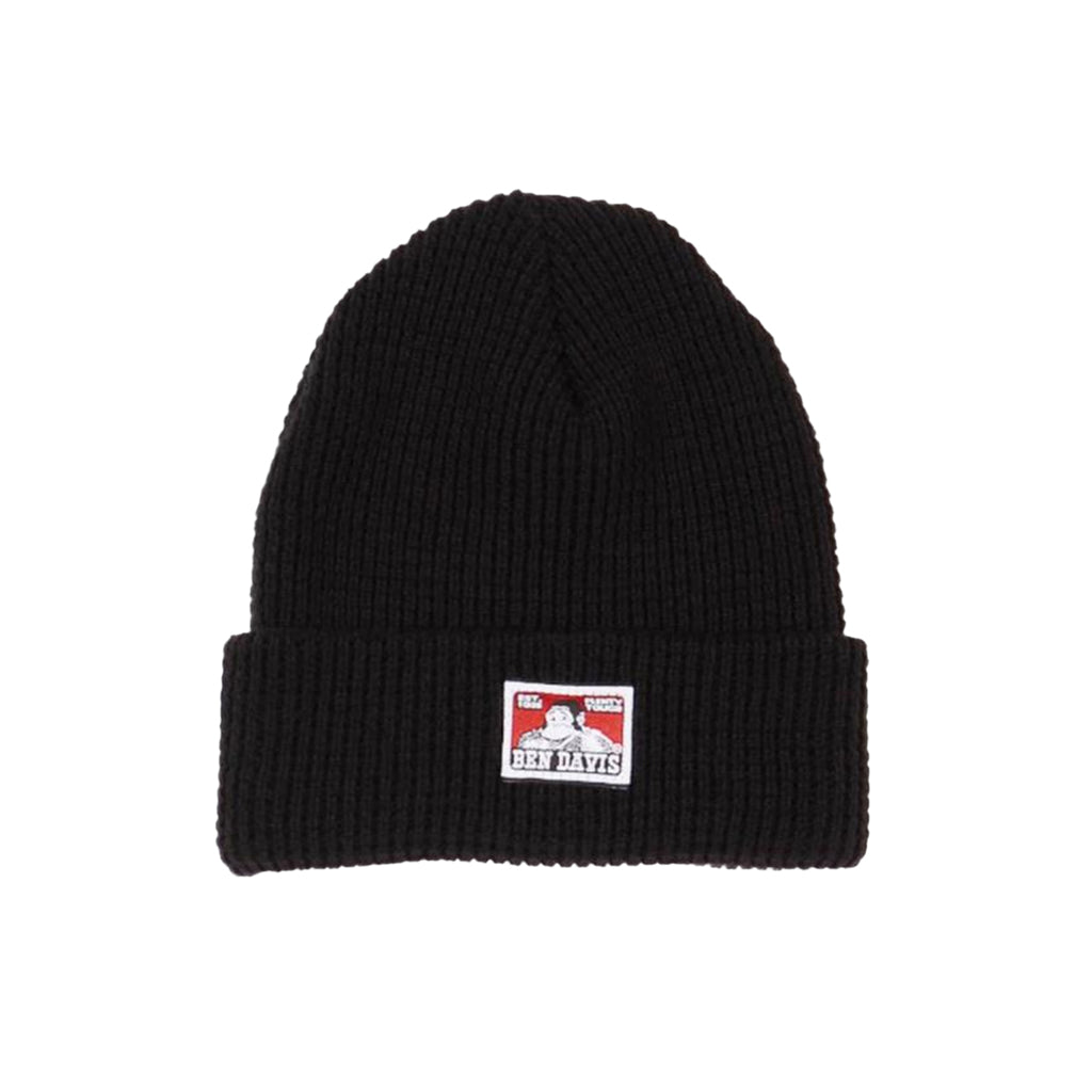 Black beanie with a red and white label on a white background