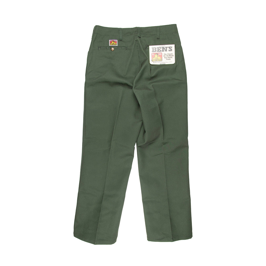 Green pants with a brand label on a white background