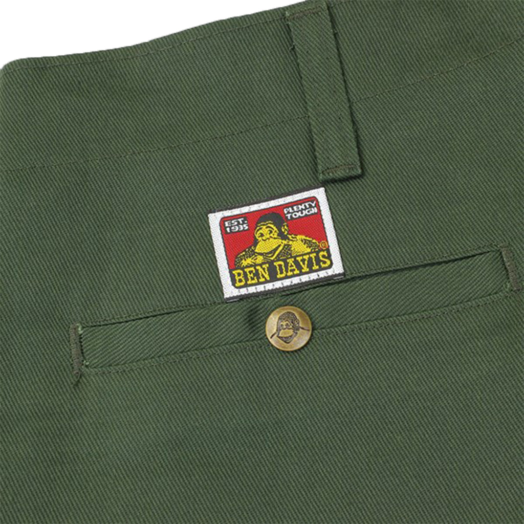 Green pants with a Ben Davis label on a white background