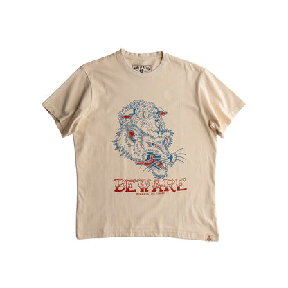 Beige t-shirt with a wolf graphic and 'Beware' text on a white background