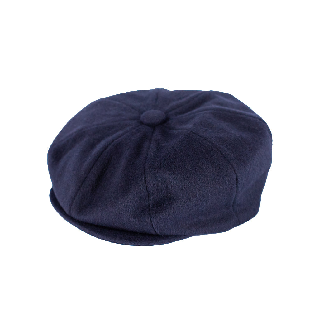 Navy blue flat cap on a white background