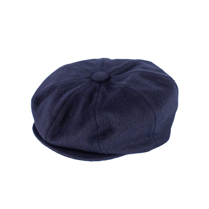 Navy blue flat cap on a white background