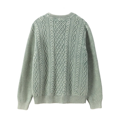 Green cable knit sweater on a white background