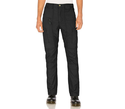 Black pants worn by a person on a white background