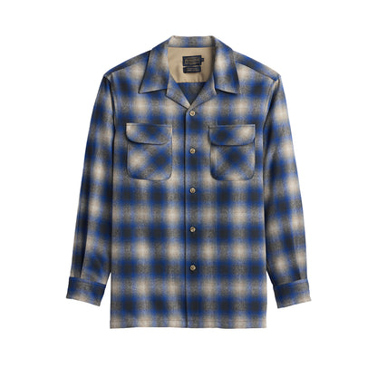 Blue and gray plaid shirt on a white background