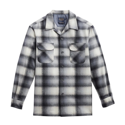 a long-sleeved, plaid board shirt with a tan and slate ombre design on a white background