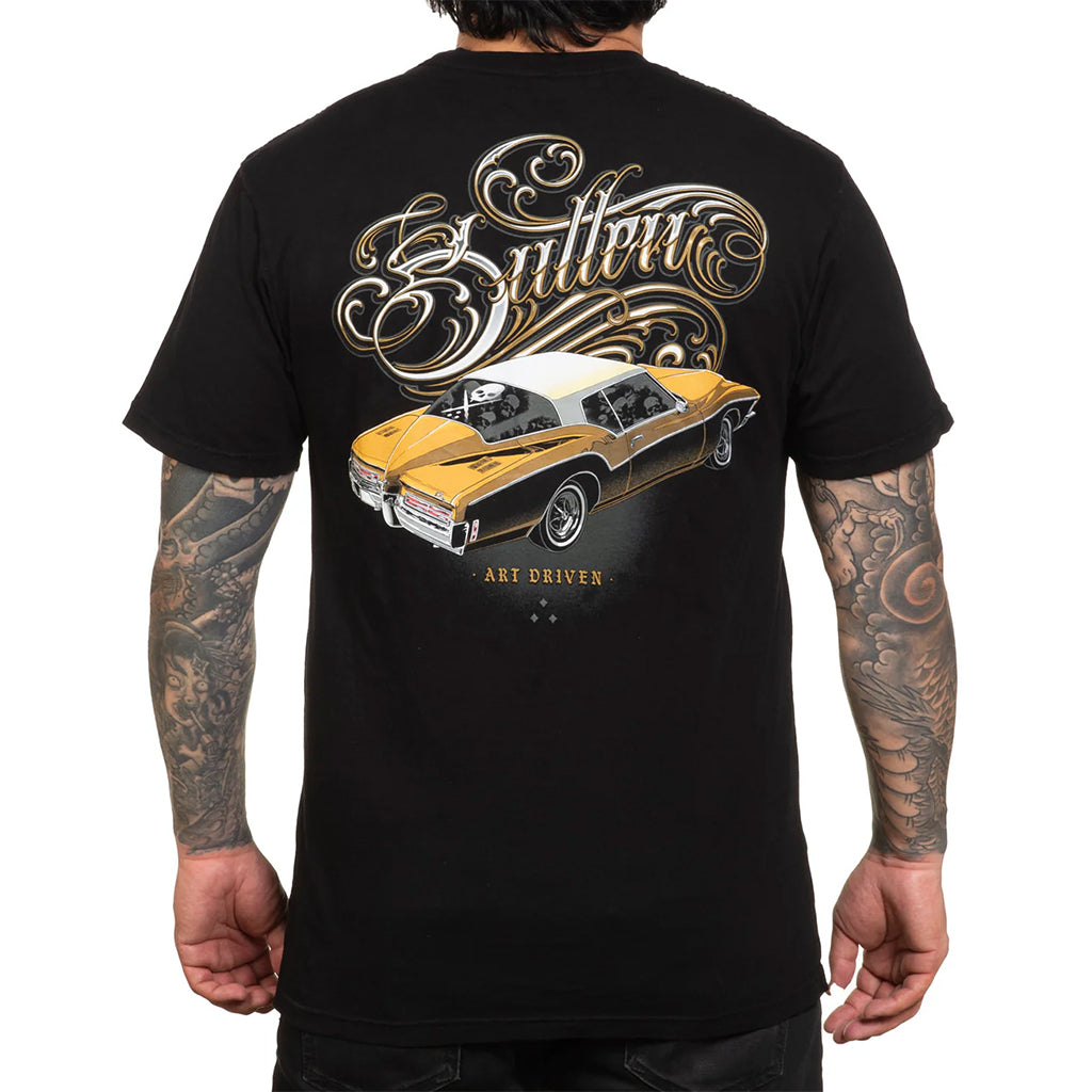 Black t-shirt with a gold car graphic and 'Sullen' branding on the back, worn by a person.