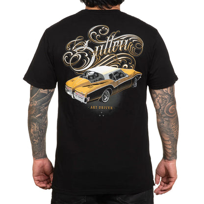 Black t-shirt with a gold car graphic and 'Sullen' branding on the back, worn by a person.