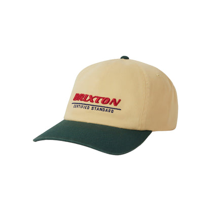 Beige and green cap with Drixtton logo on a white background
