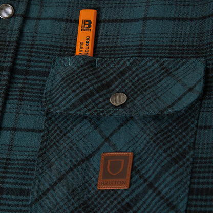 Close up of snap button and pencil holder on front of the brixton jacket