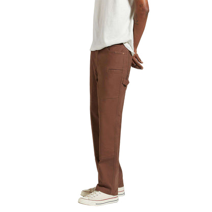 Brown cargo pants worn by a person on a white background