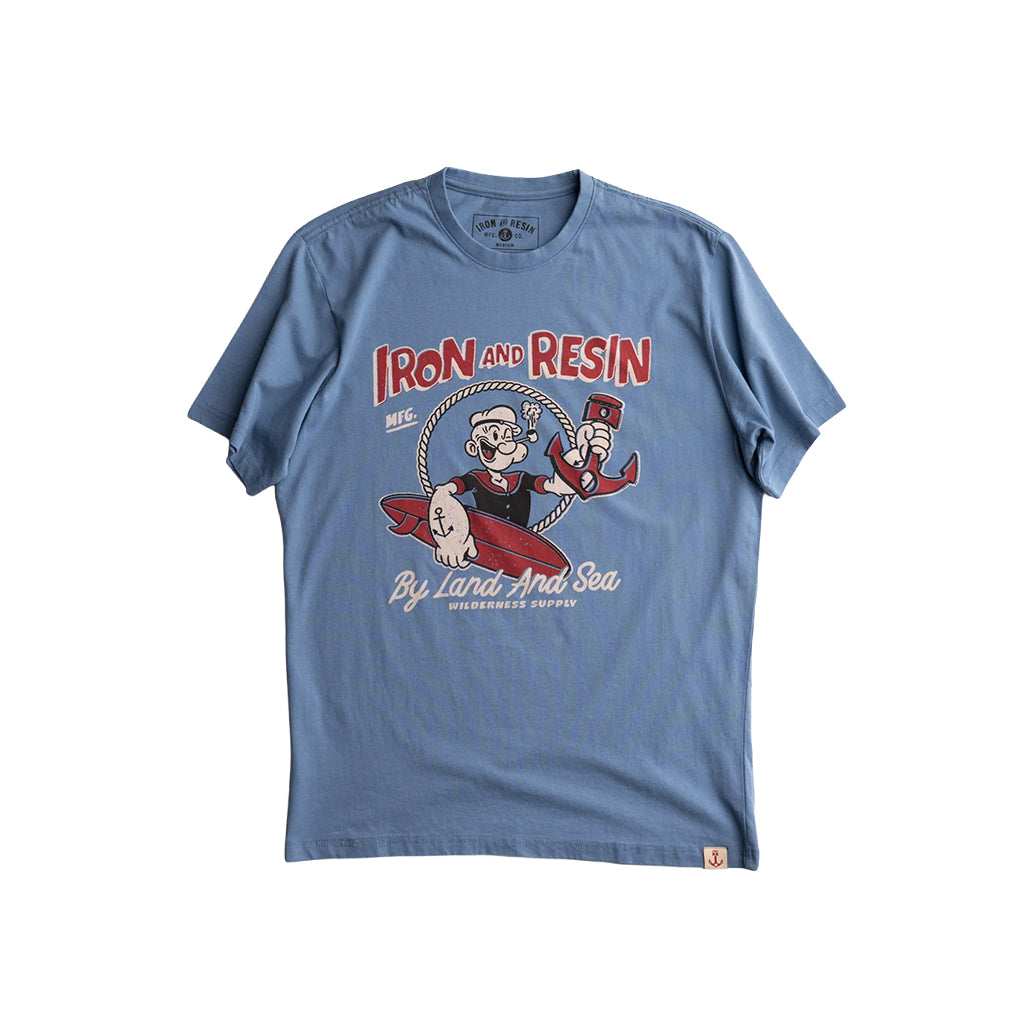 Blue t-shirt with a graphic design on a white background