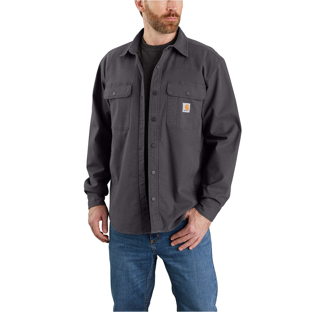 Model wearing a grey canvas jacket on a white background