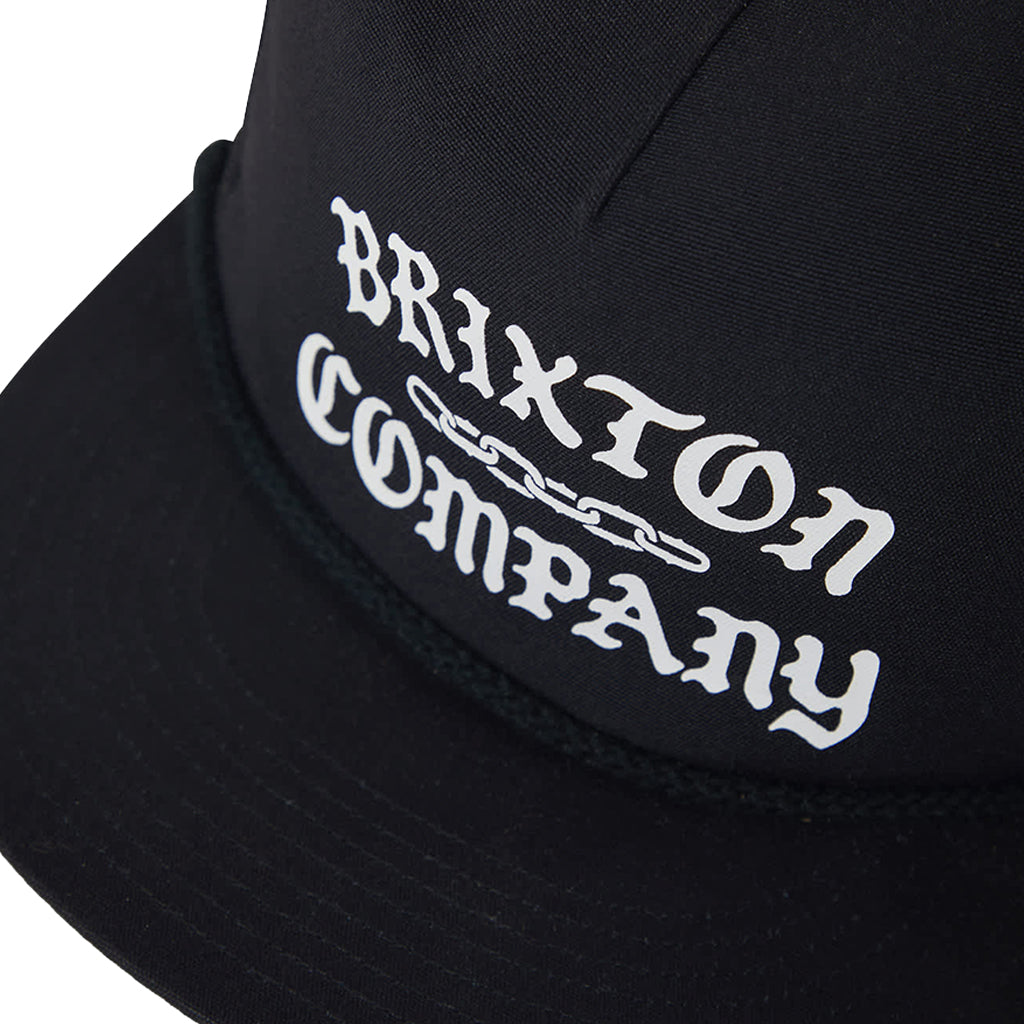 Black cap with 'Brixton Company' logo on a white background