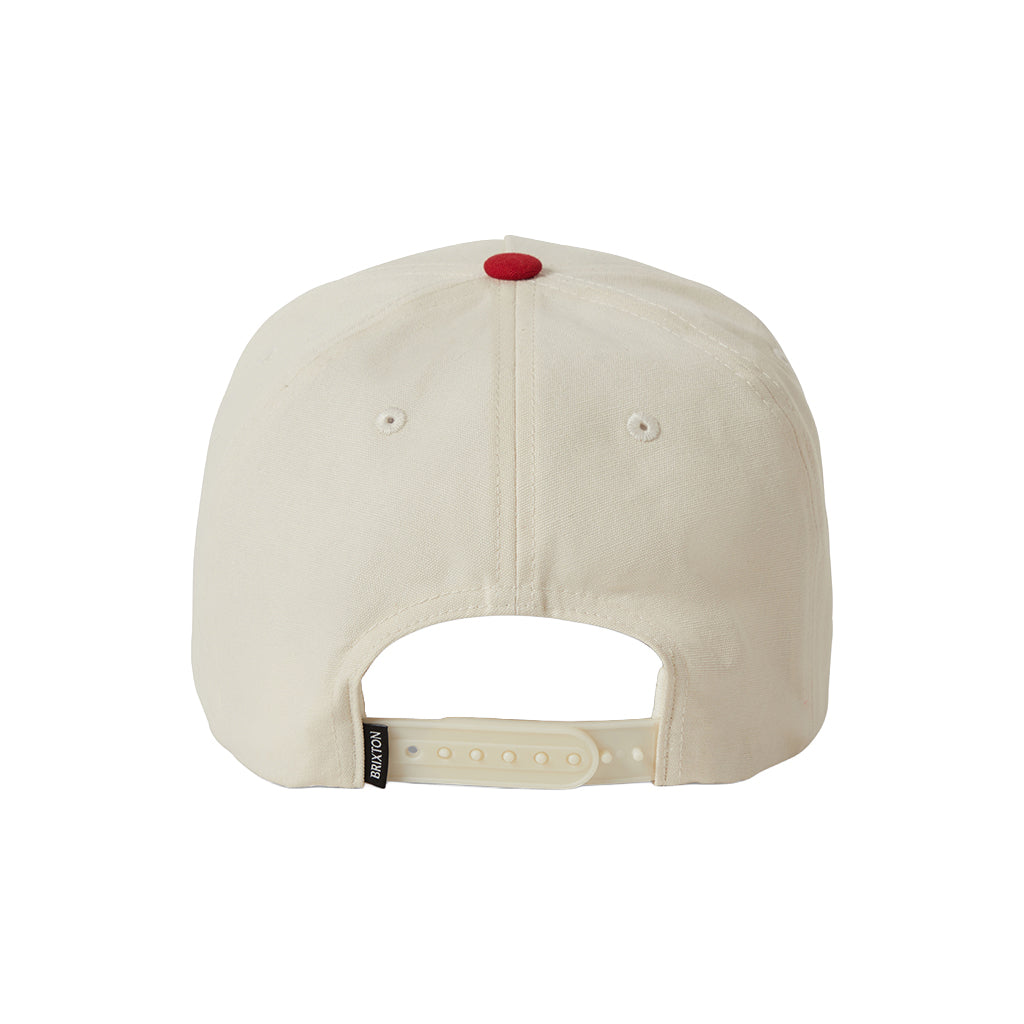 Beige cap with a red button on a white background