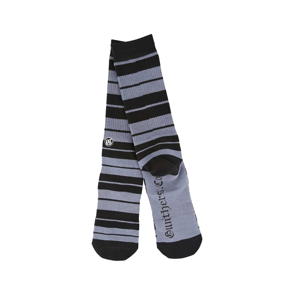 Pair of black and gray striped socks on a white background