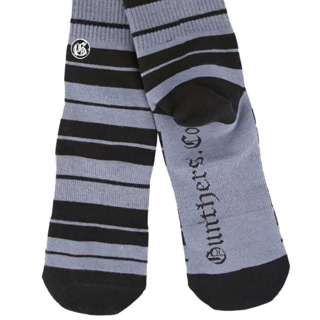 Gray and black striped socks with visible branding on a white background