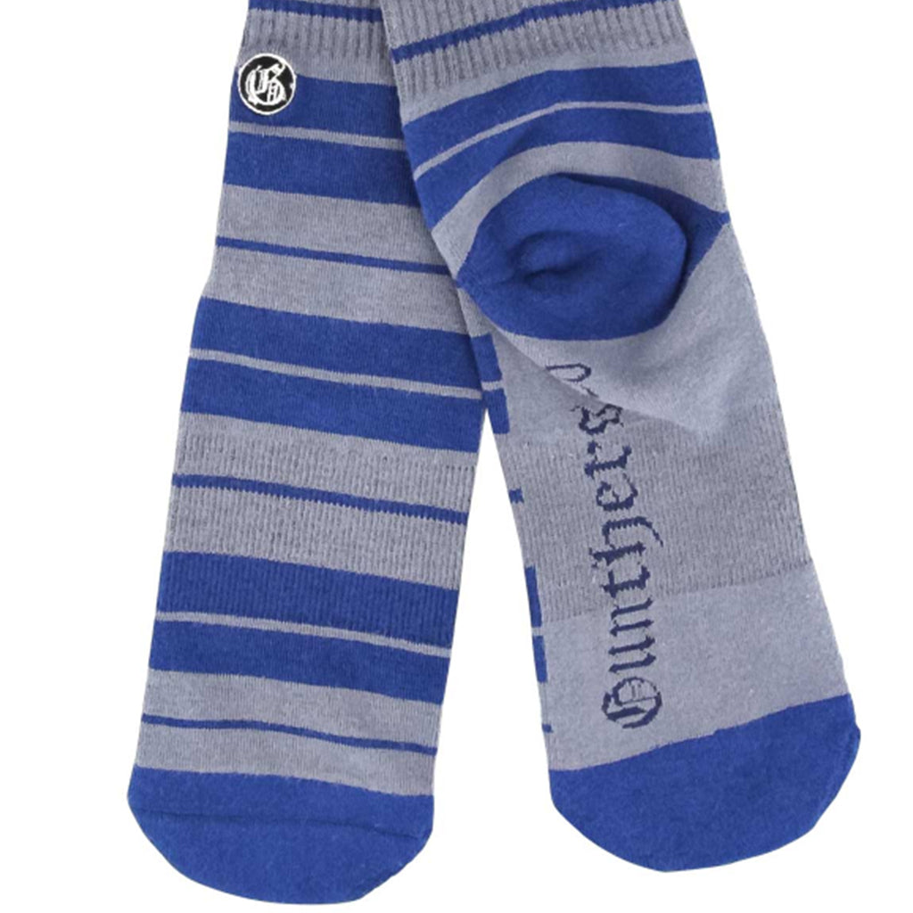 Blue and gray striped socks with Gunthers branding on a white background