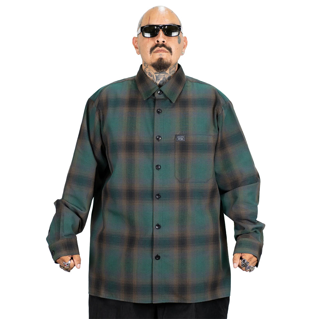 Man wearing a green plaid shirt on a white background