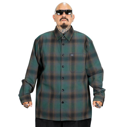 Man wearing a green plaid shirt on a white background