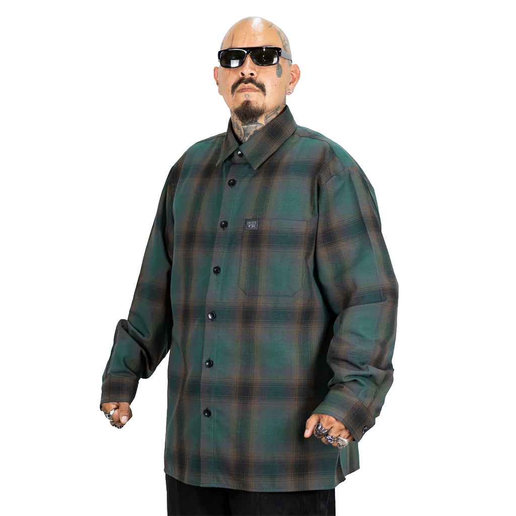 Man wearing a green plaid shirt on a white background