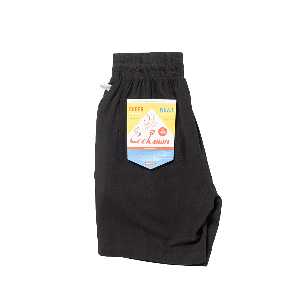 Cookman shorts folded to show the cookman label on a white background