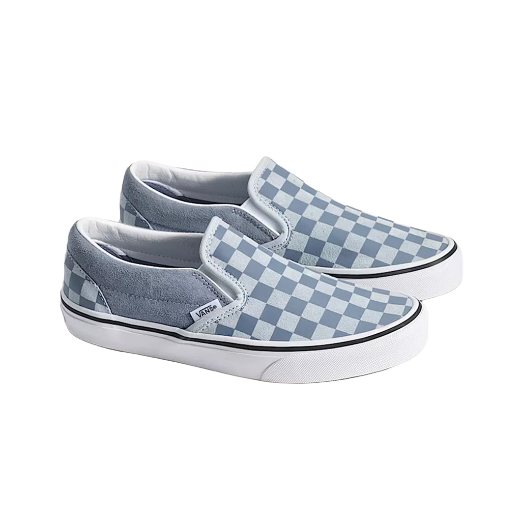 Pair of gray and white checkered slip-on sneakers on a white background
