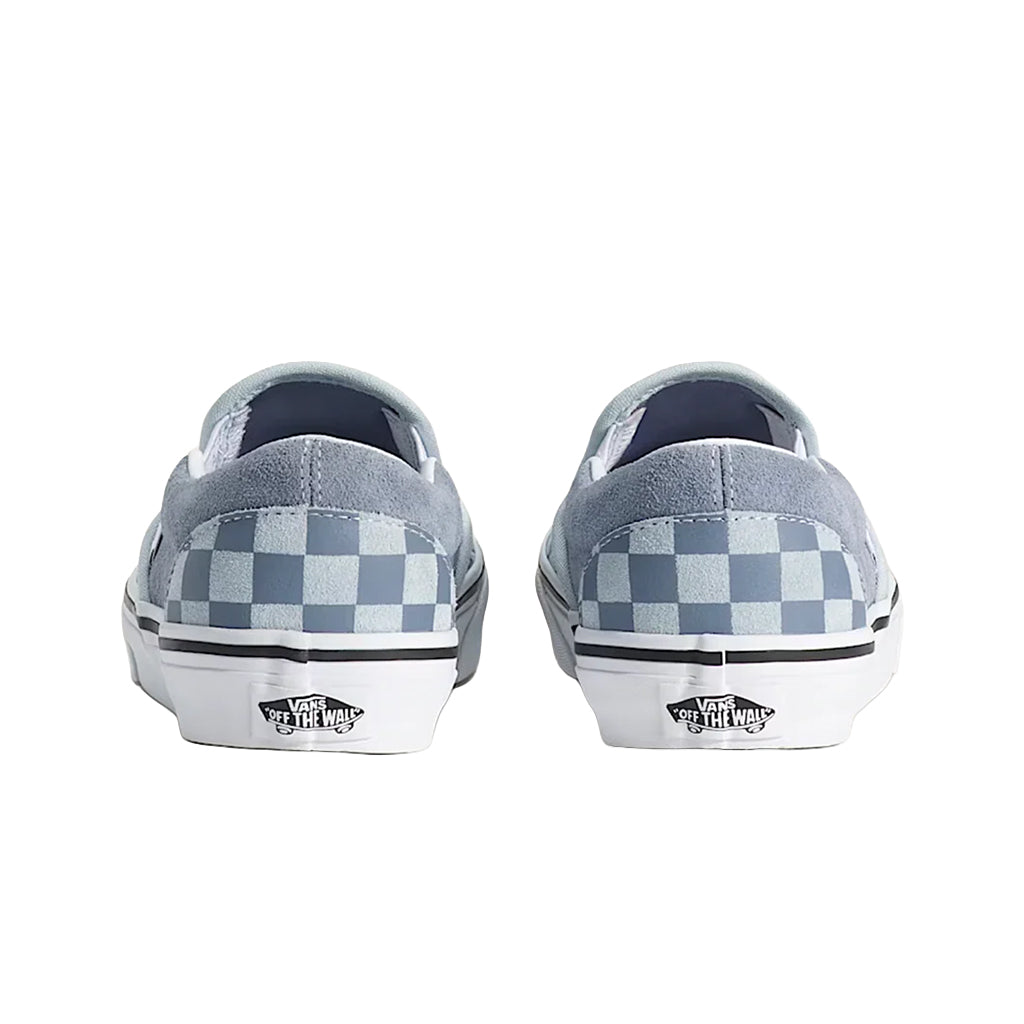 Pair of Vans shoes with checkered pattern on a white background