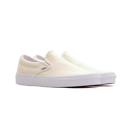 White slip-on sneakers with a visible brand logo on a white background