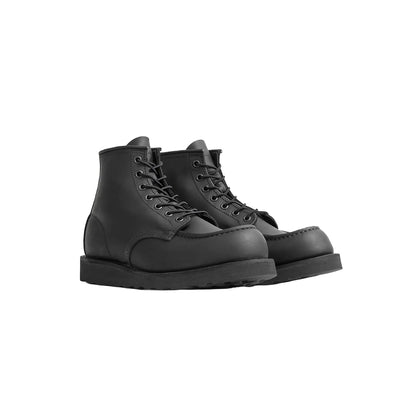 Pair of black leather boots on a white background