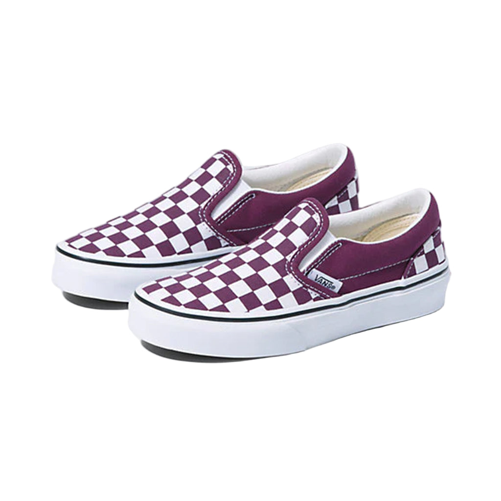 Purple and white checkered slip-on shoes on a light gray background