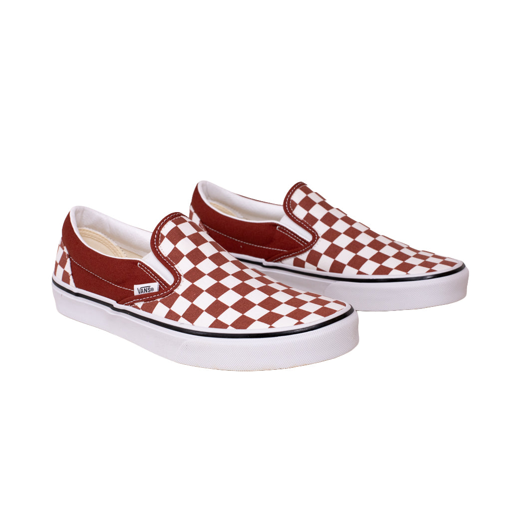 Pair of checkered slip-on shoes on a white background