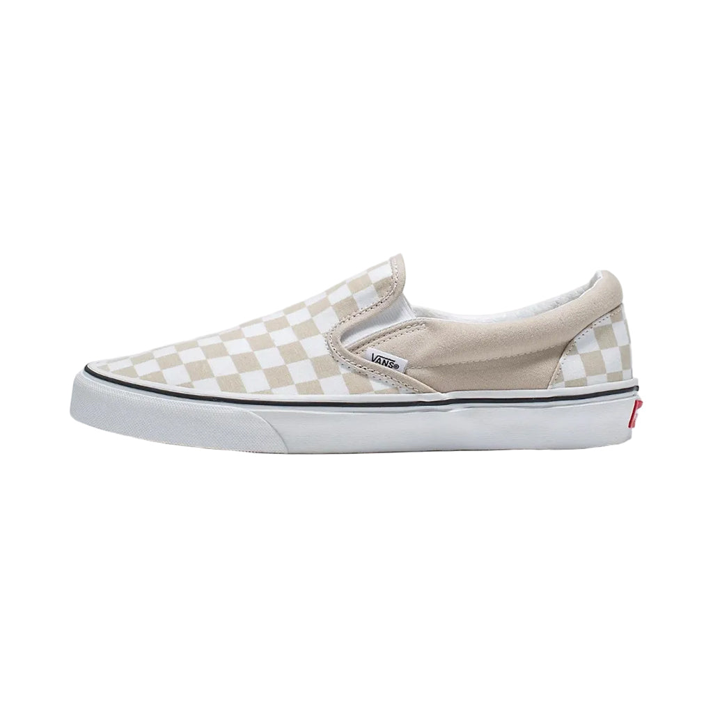 Blue slip-on sneaker with white sole on a white background
