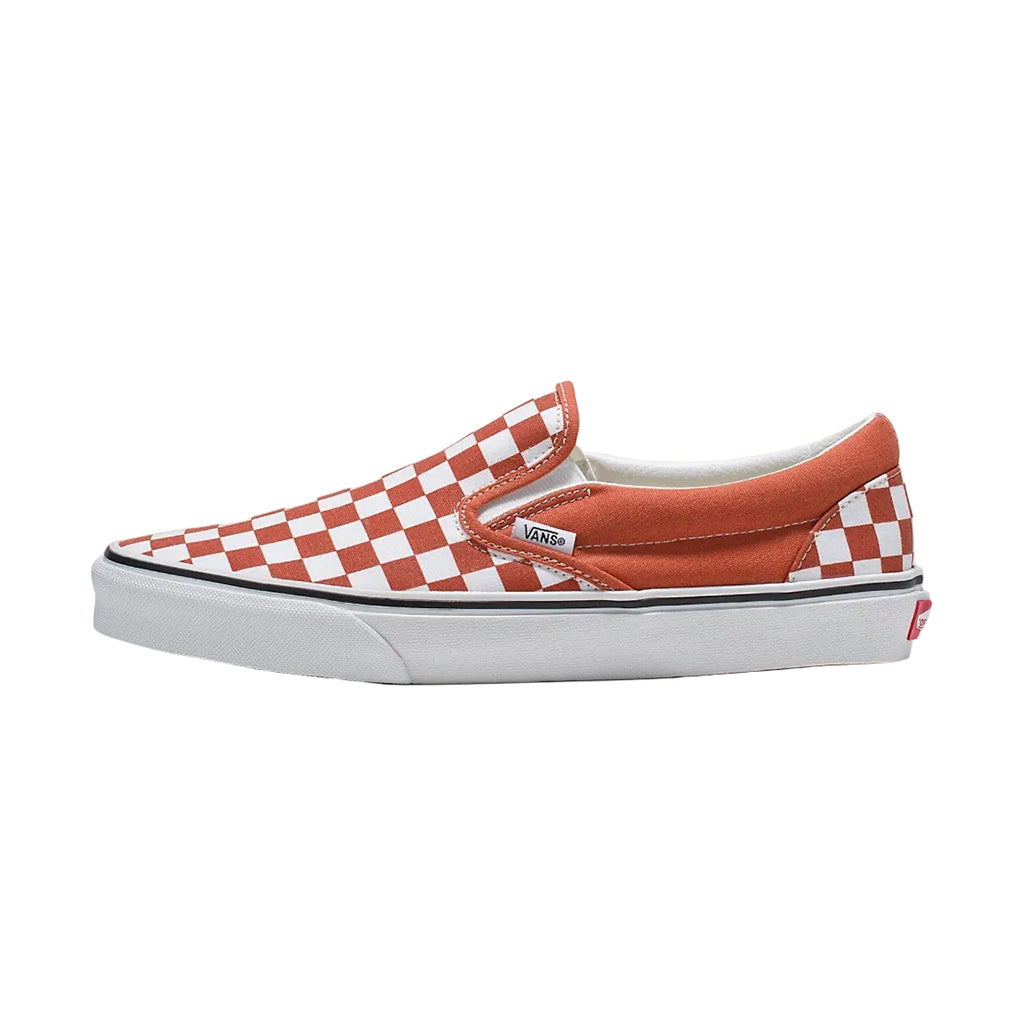 Pair of red and white checkered slip-on shoes on a white background
