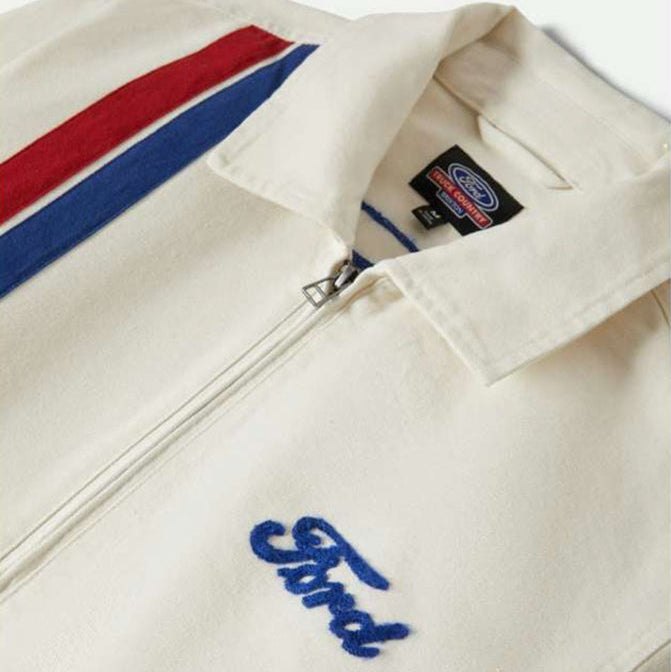 Close-up of a white jacket with a Ford logo on a white background