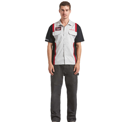 Man wearing a work uniform with a visible brand logo on a white background