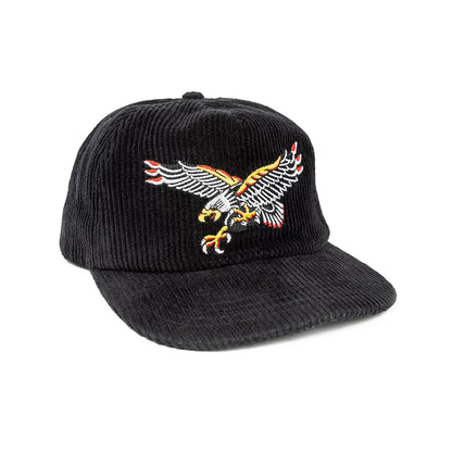 Black corduroy cap with an embroidered eagle design on a white background