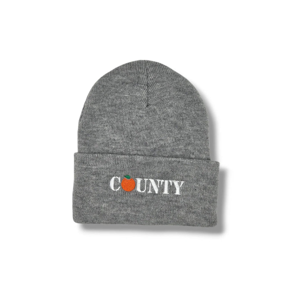 Grey beanie with County embroidered on the cuff on a white background 