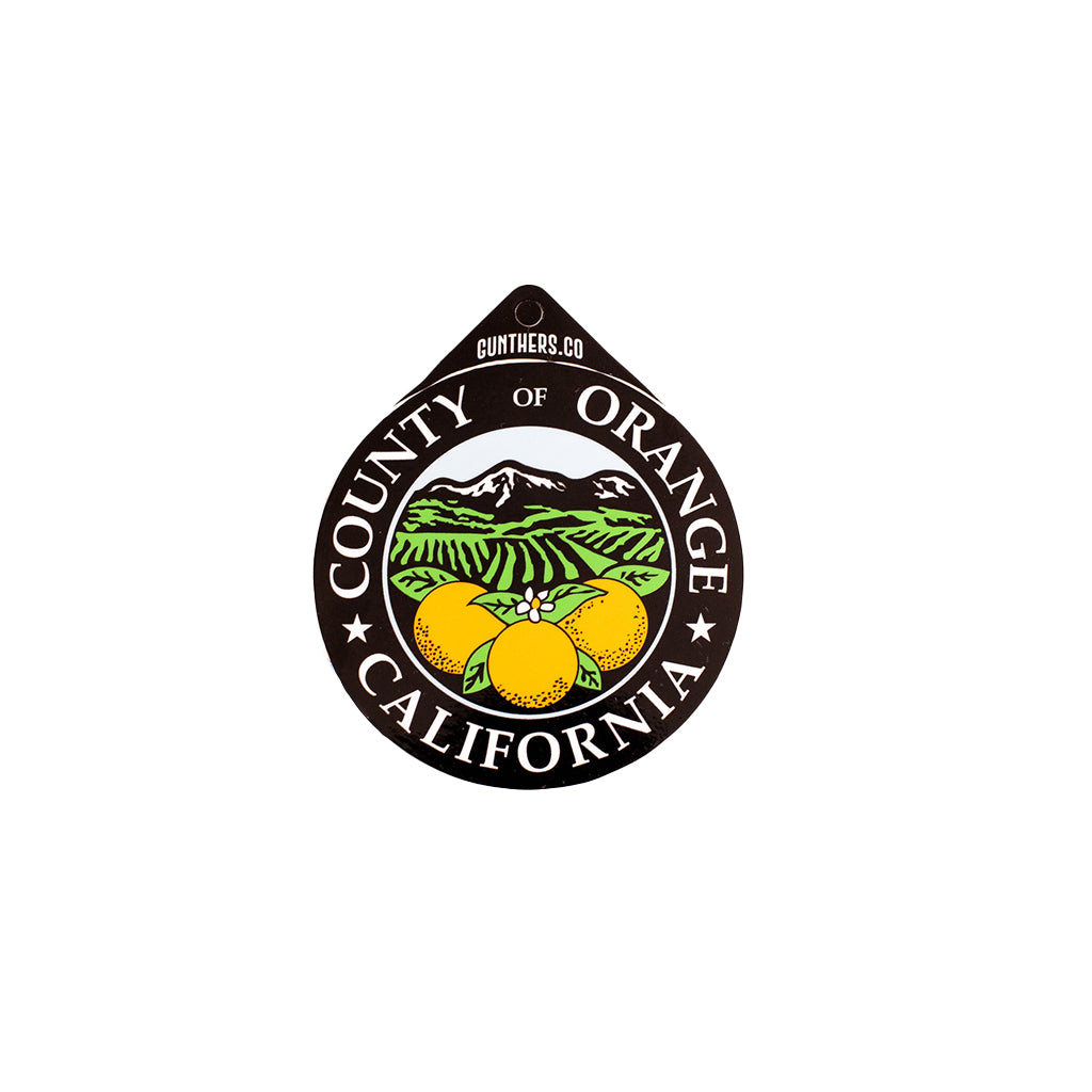 Logo of the County of Orange, California featuring oranges and mountains on a white background.