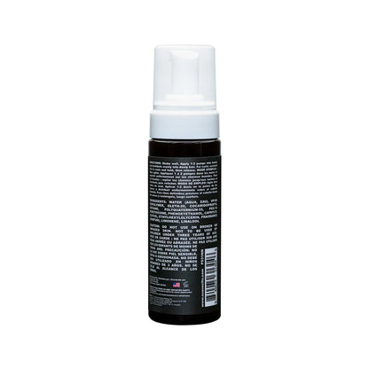 Back of Curl Mousse bottle on a white background