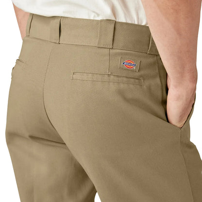 Beige pants with a Dickies logo on a white background