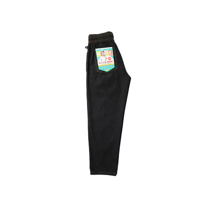 Black pants with a colorful label on a white background