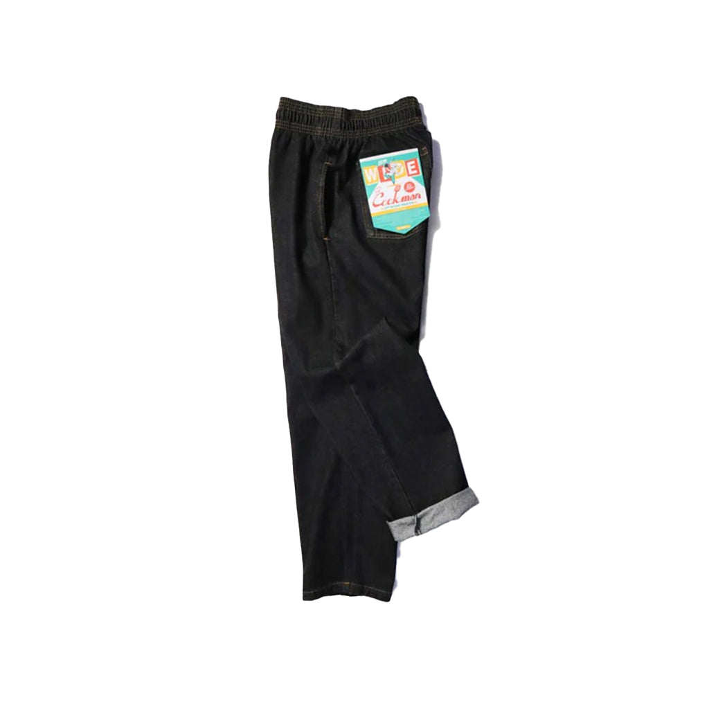 Black pants with a tag on a white background