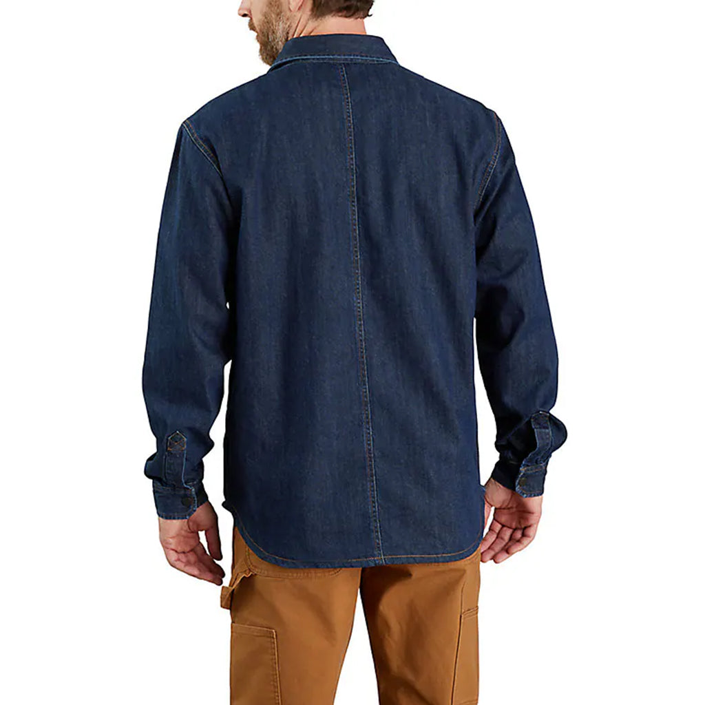 Man wearing a blue denim shirt and brown pants on a white background