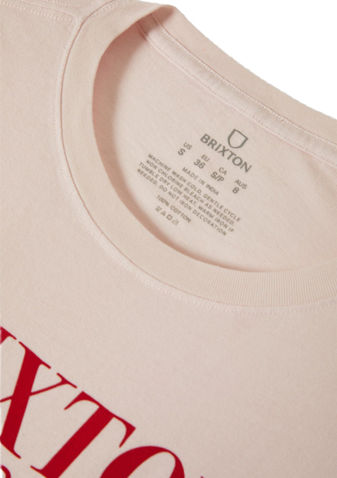 Close-up of a beige t-shirt with red text and Brixton branding.
